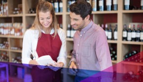 Store managers reading a book