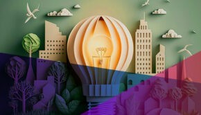 graphic design of a lit light bulb in the middle of a city
