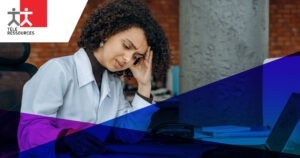 A stressed woman at her desk