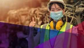 Female industrial worker giving a thumbs up