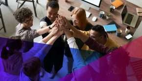 a group of employees high-fiving each other