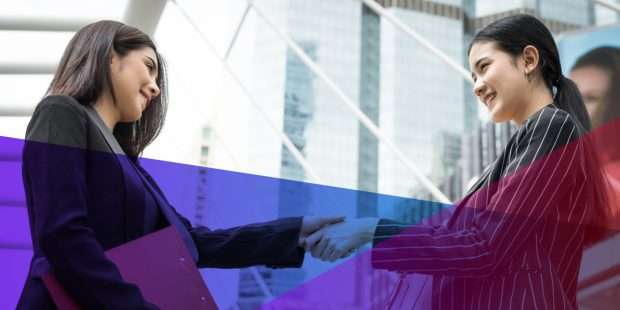 Businesswomen shaking hands