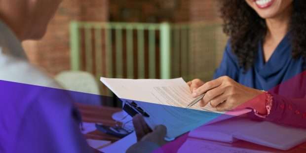 a hiring manager pointing to an item on a candidate's CV
