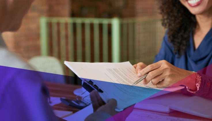 a hiring manager pointing to an item on a candidate's CV