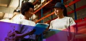 Warehouse workers looking over a checklist in a warehouse