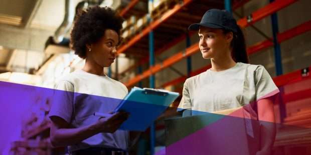 Warehouse workers looking over a checklist in a warehouse