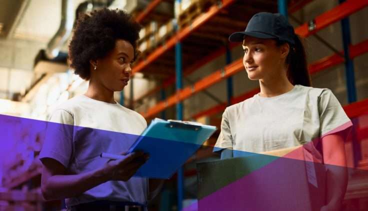 Warehouse workers looking over a checklist in a warehouse